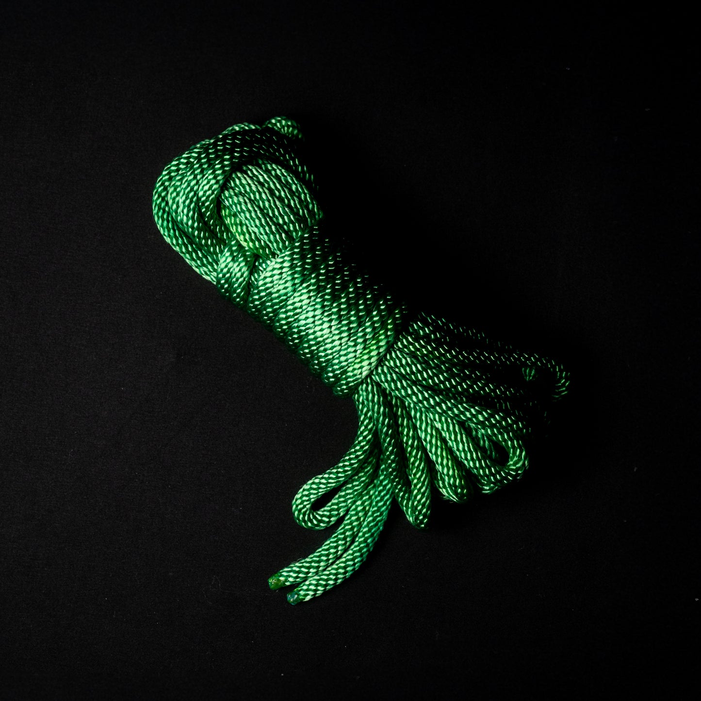 15 ft nylon rope bundle in Fairy Green, a bright UV-reactive grass green nylon rope with glowing neon yellow undertones that shine through, creating an otherworldly, enchanted glow under black light.
