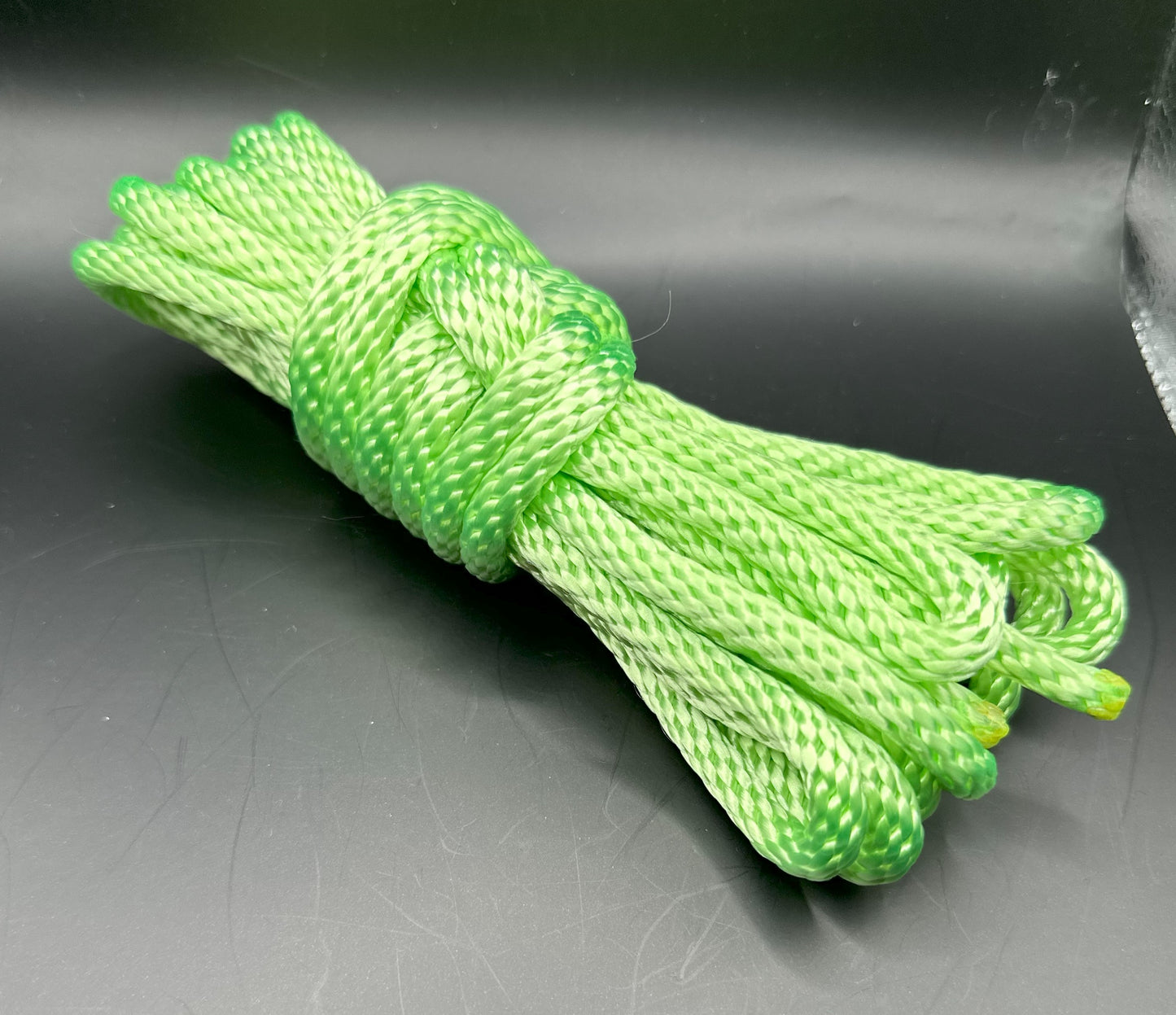 15 ft nylon rope bundle in Screamin' Neon - a light yellow green in day time lighting, but under the black light, this shade screams so loud you can't ignore it.  
