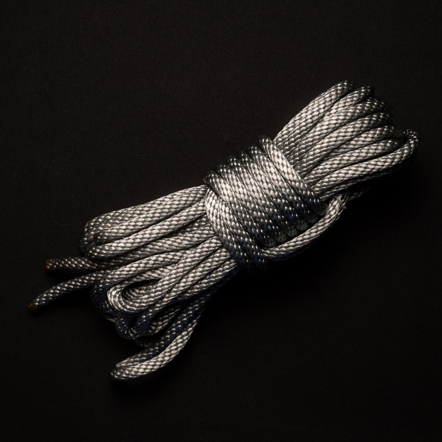 30 ft nylon rope bundle in Electric Silver Lining, a light metallic gray nylon rope with a cool silver sheen and subtle blue undertones, reminiscent of polished steel under bright light.