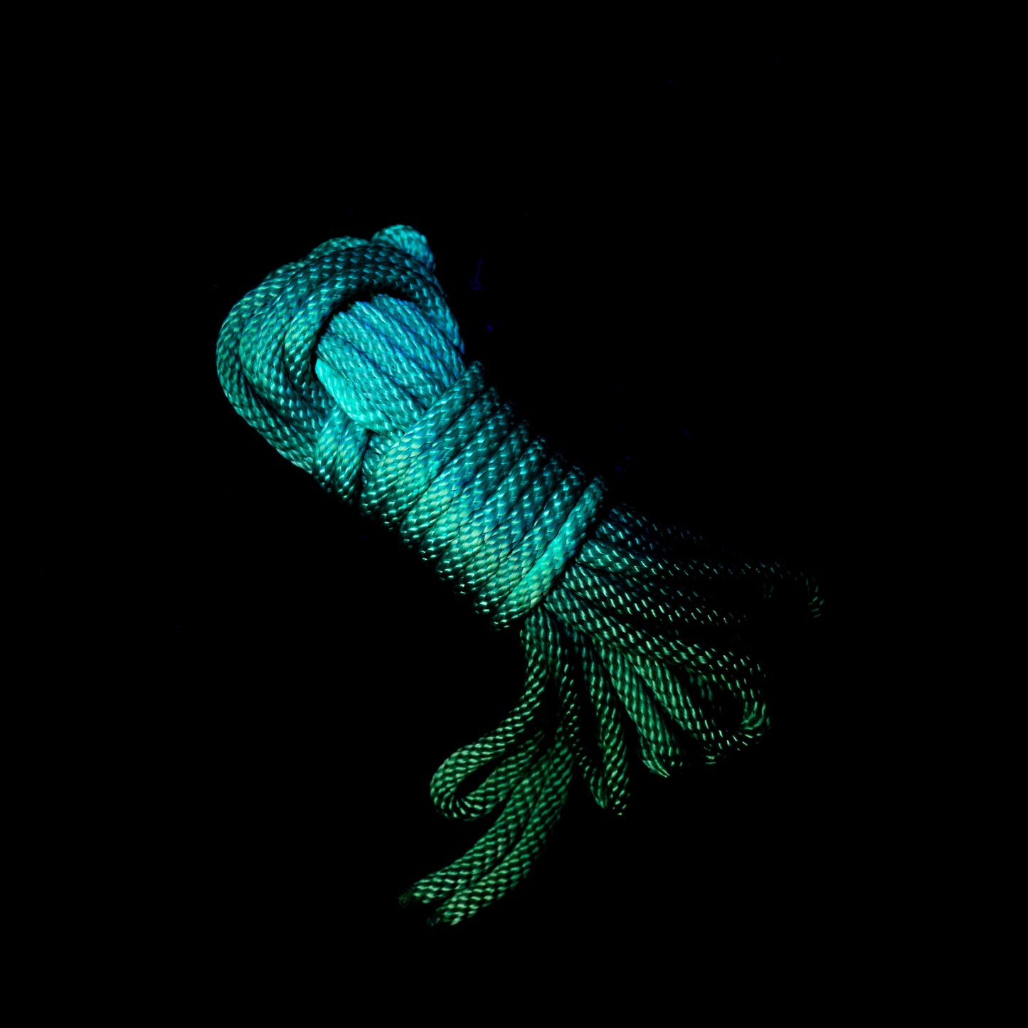 30 ft nylon rope bundle in Fairy Green, a bright UV-reactive grass green nylon rope with glowing neon yellow undertones that shine through, creating an otherworldly, enchanted glow under black light.
