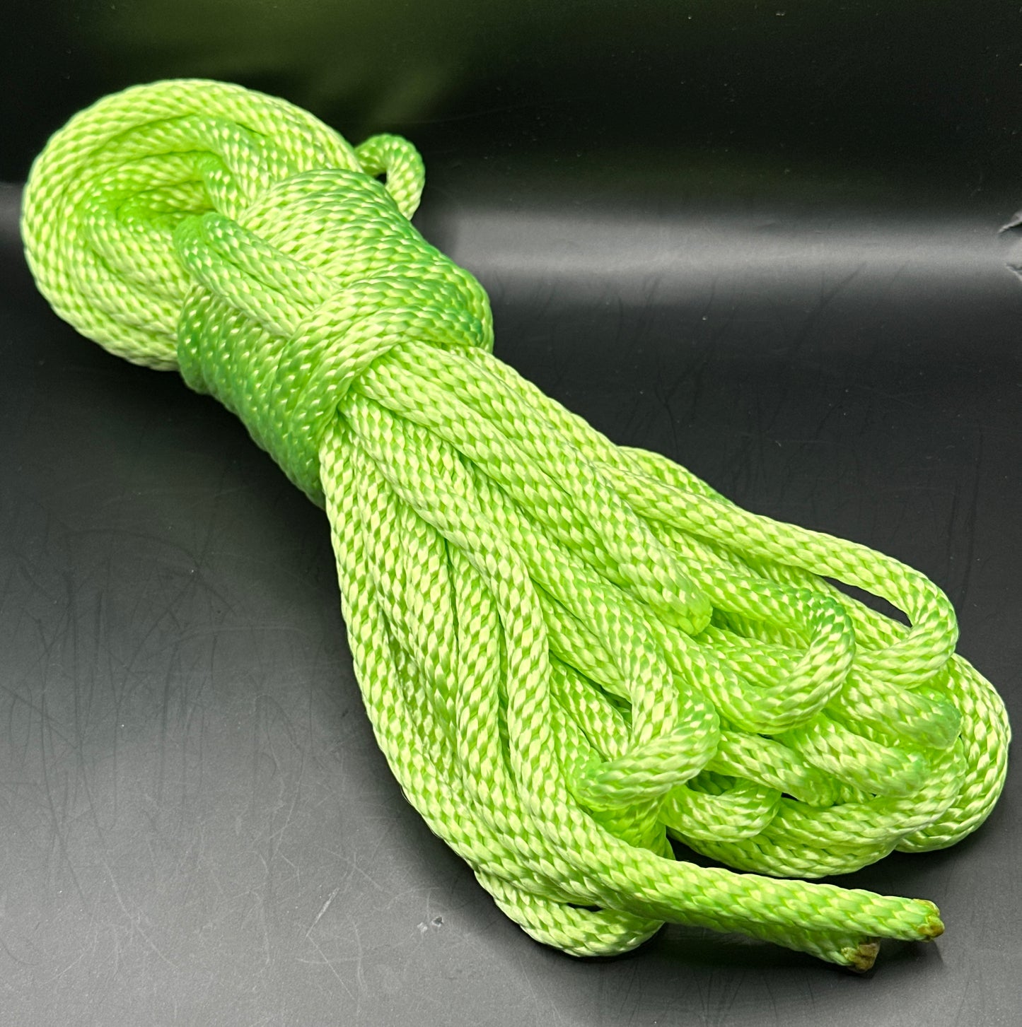 30 ft nylon rope bundle in Screamin' Neon - a light yellow green in day time lighting, but under the black light, this shade screams so loud you can't ignore it. 