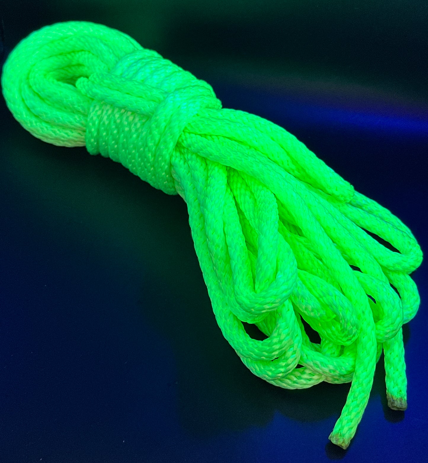 30 ft nylon rope bundle in Screamin' Neon - a light yellow green in day time lighting, but under the black light, this shade screams so loud you can't ignore it.  