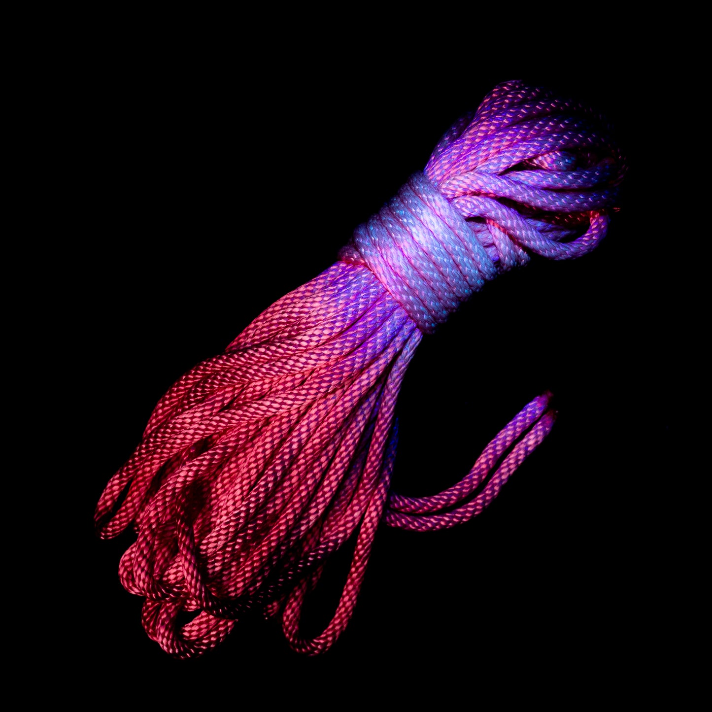 pictured is a 50 ft nylon rope bundle in Electric Pink Lemonade, a vivid neon pink rope with warm coral undertones that glows under UV light, bright and effervescent like its namesake drink.