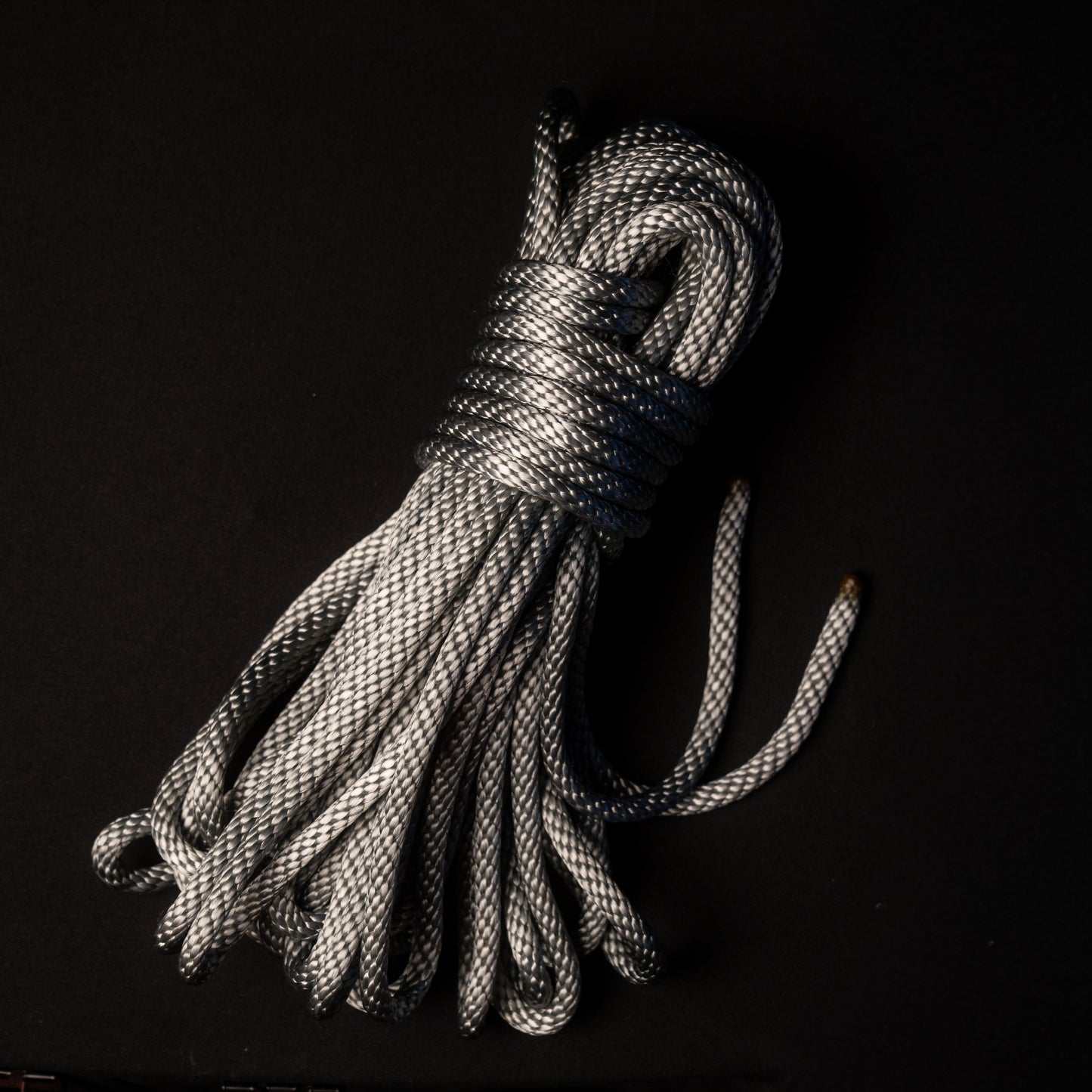 50 ft nylon rope bundle in Electric Silver Lining, a light metallic gray nylon rope with a cool silver sheen and subtle blue undertones, reminiscent of polished steel under bright light.