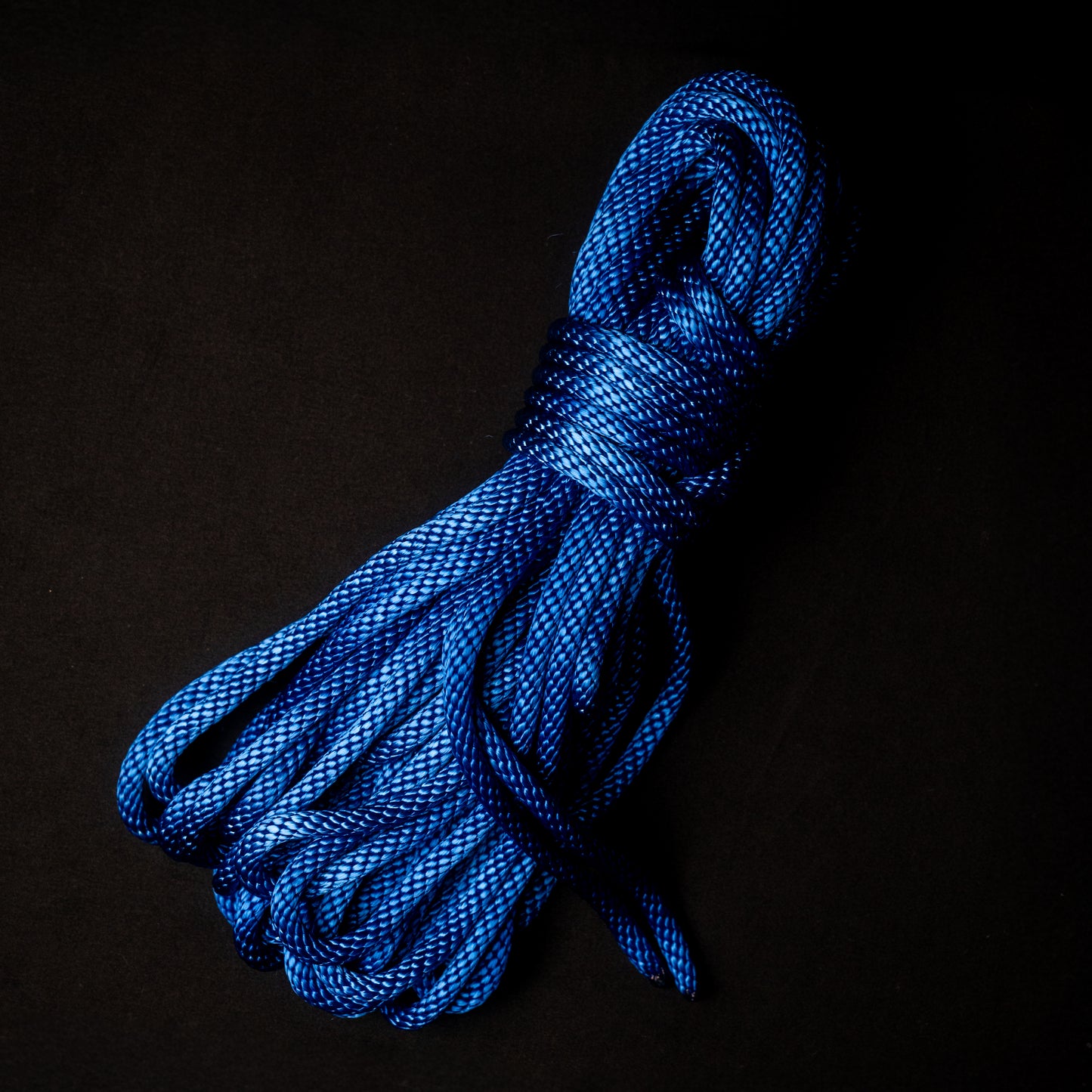 50 ft nylon rope bundle in Neon Whovian Blue — deep royal ultramarine with a glow that blazes galactic under blacklight.