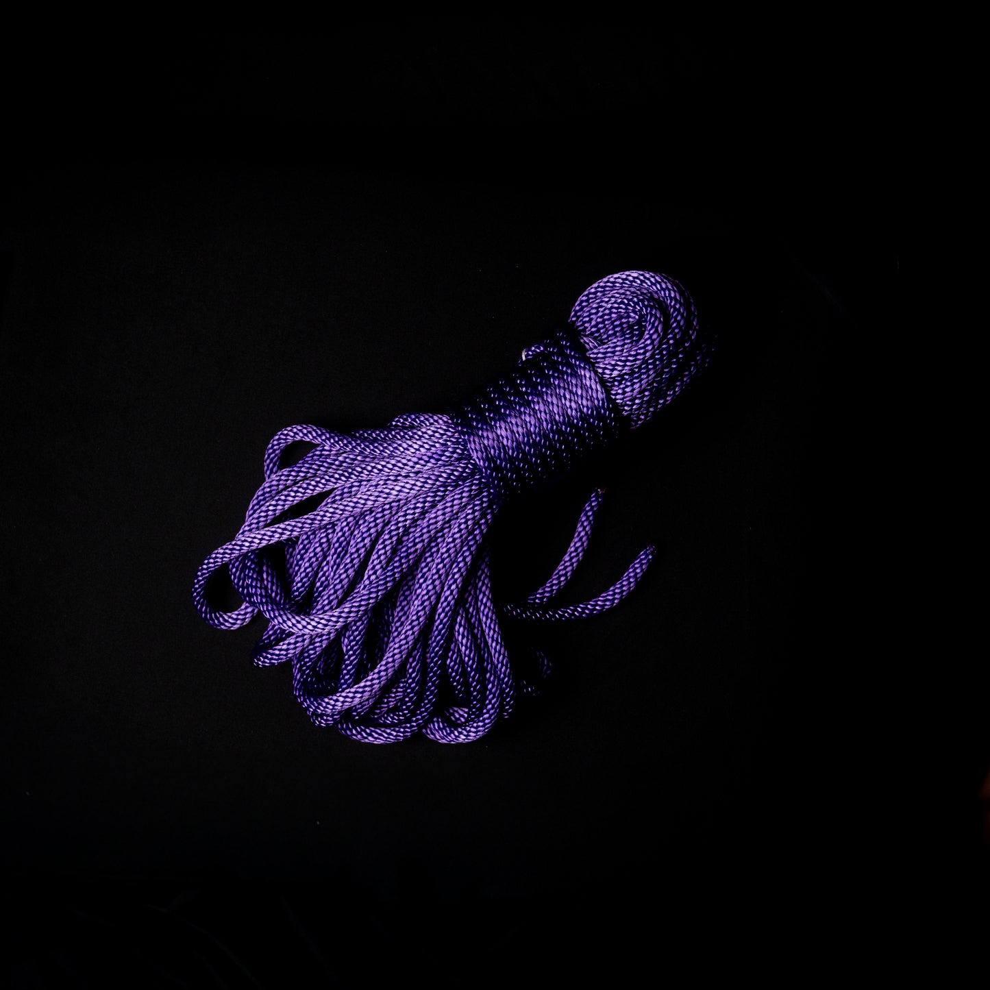 50 ft nylon rope bundle in Purple Passion, a vibrant royal purple with cool blue undertones that glows a bold, electric violet under UV light — rich, radiant, and unmistakably alive.