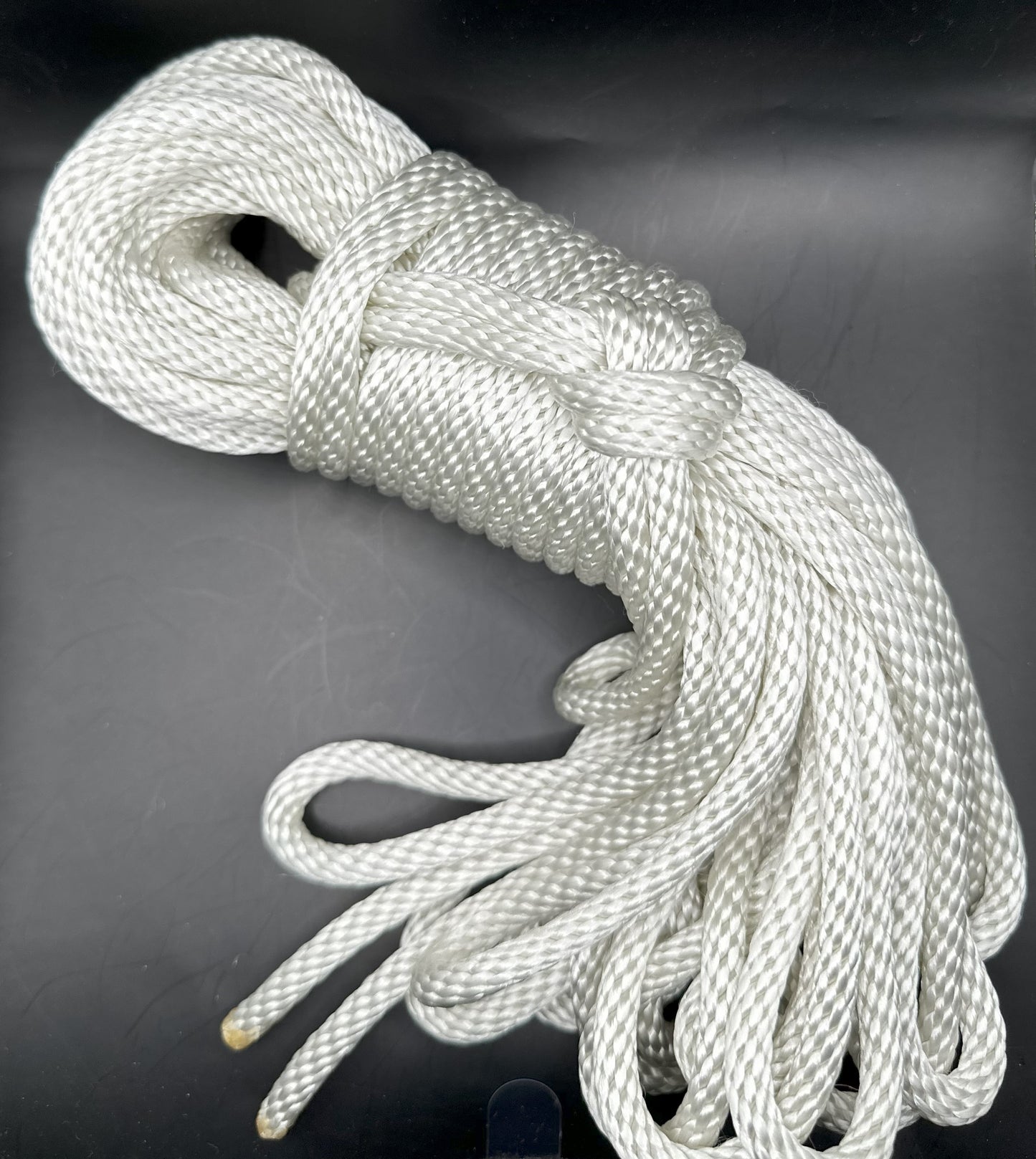 50 ft nylon rope bundle in basic white, with a lovely iridescence from the shiny nylon rope.