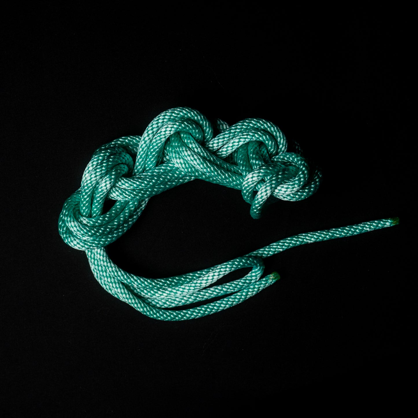 15 ft nylon rope bundle with minor manufacturing imperfections in Mermaid Mint — a luminous seafoam green rope that glows like enchanted ocean light under blacklight.