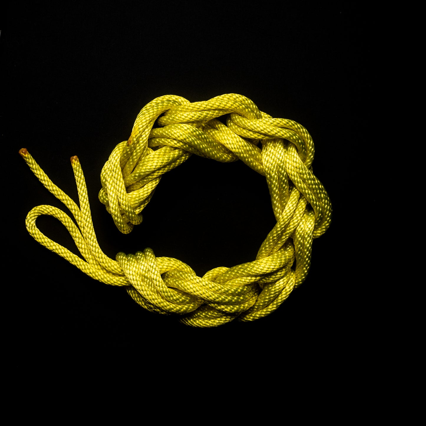 30 ft nylon rope bundle with minor manufacturing imperfections in Banana Bound (UV), a bright neon yellow with mild green undertones under UV light.