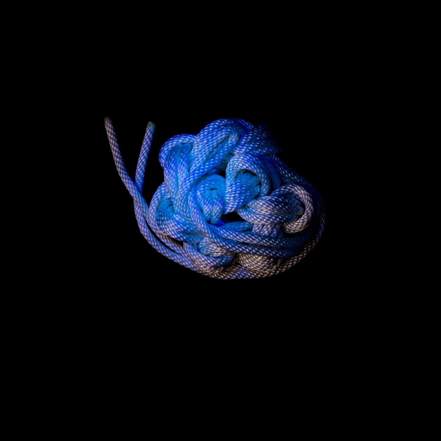 30 ft nylon rope bundle with minor manufacturing imperfections in Lunar Light White, a glossy rope with a pearlescent sheen that shimmers like moonlight — softly iridescent and glowing with a celestial radiance under UV light.