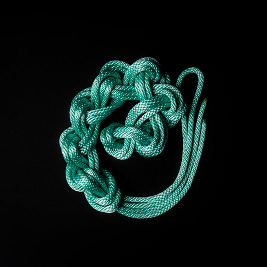 30 ft nylon rope bundle with minor manufacturing imperfections in Mermaid Mint — a luminous seafoam green rope that glows like enchanted ocean light under blacklight.