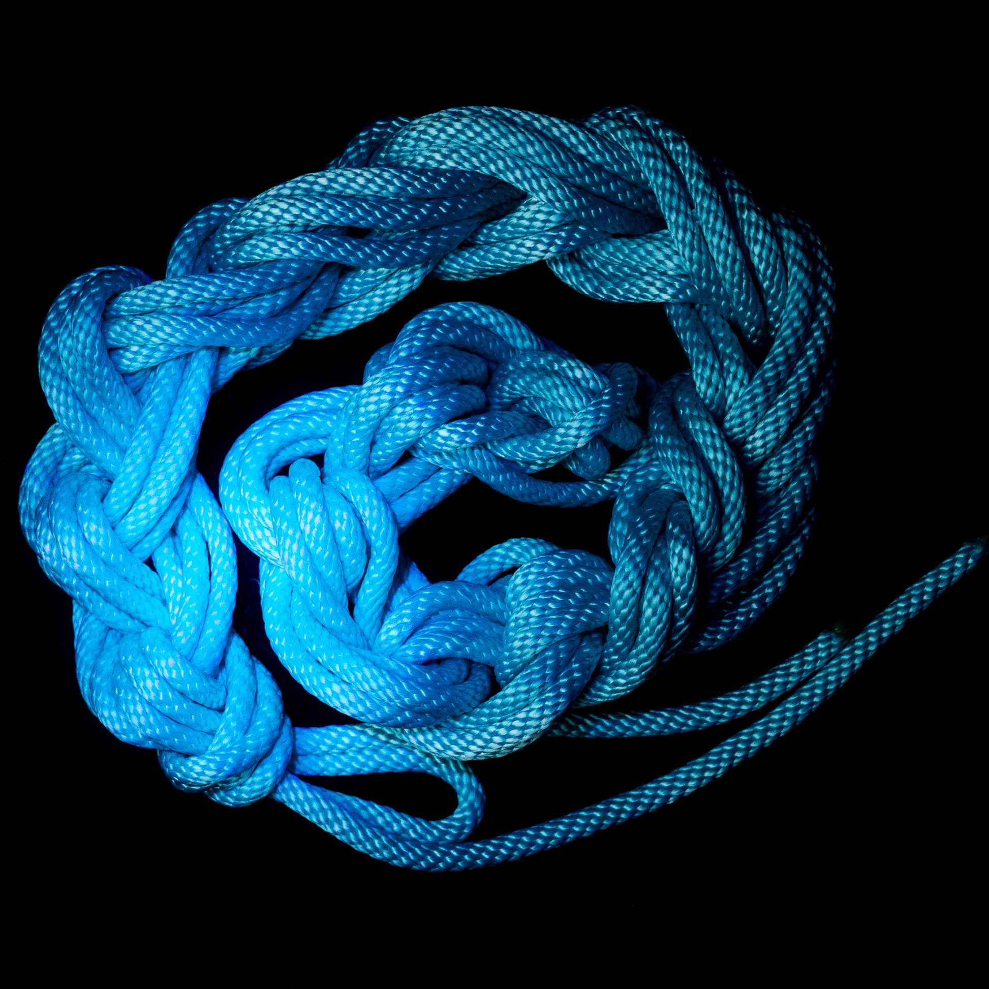 50 ft nylon rope bundle with minor manufacturing imperfections in AquaKnot, a neon water blue glowing with vibrant aquatic shimmer under UV light.
